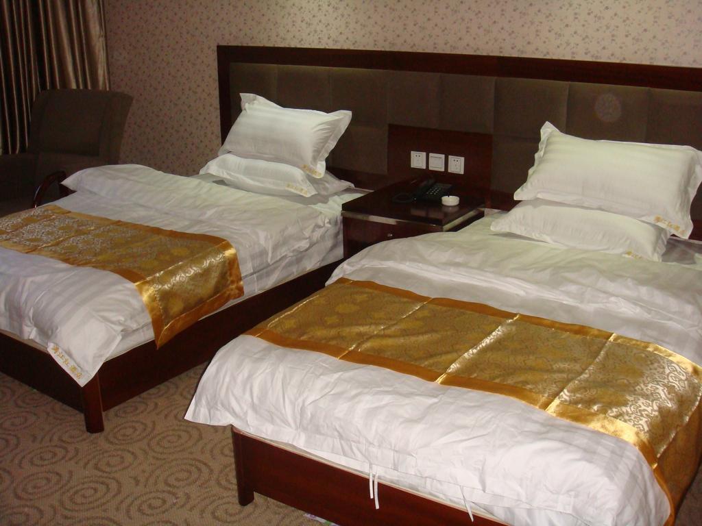 Jiuzhaigou Man Jiang Hong Hotel Rum bild
